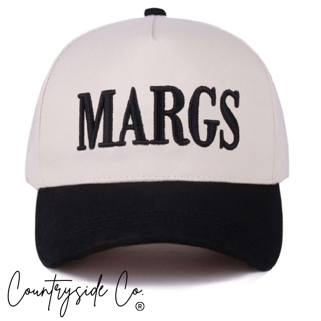 White cap with black 'MARGS' text and black visor on a white background, featuring 'Countryside Co' branding.