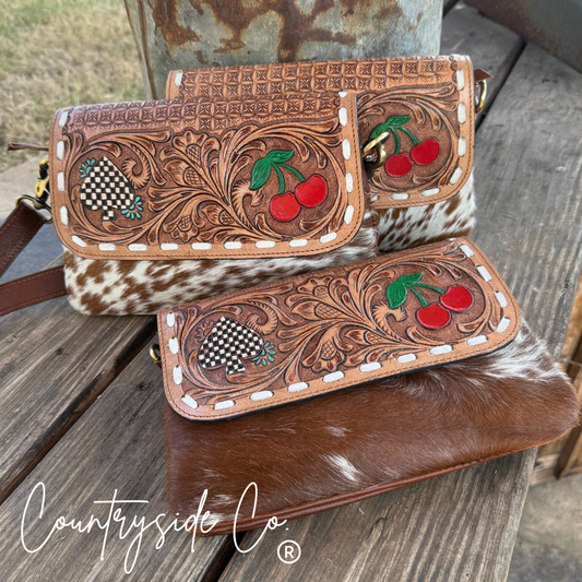 Brown tooled leather and cowhide purse with cherries and checkered spade