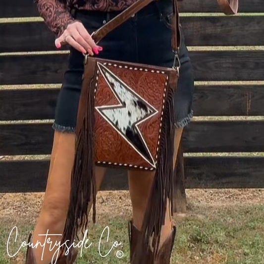 genuine leather western purse with cowhide and fringe accent