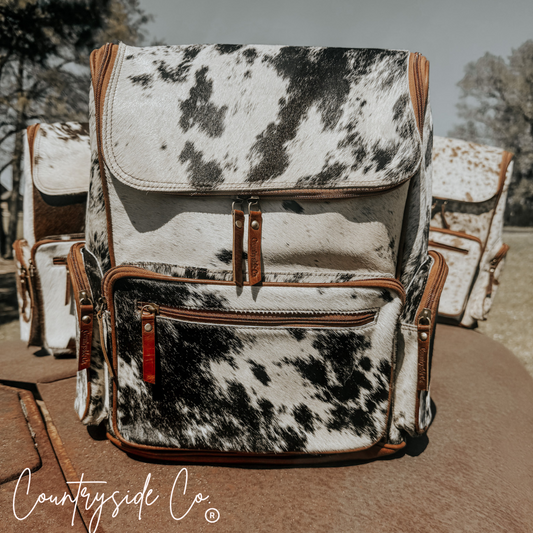 cowhide backpack with conceal carry pocket. Laptop bag