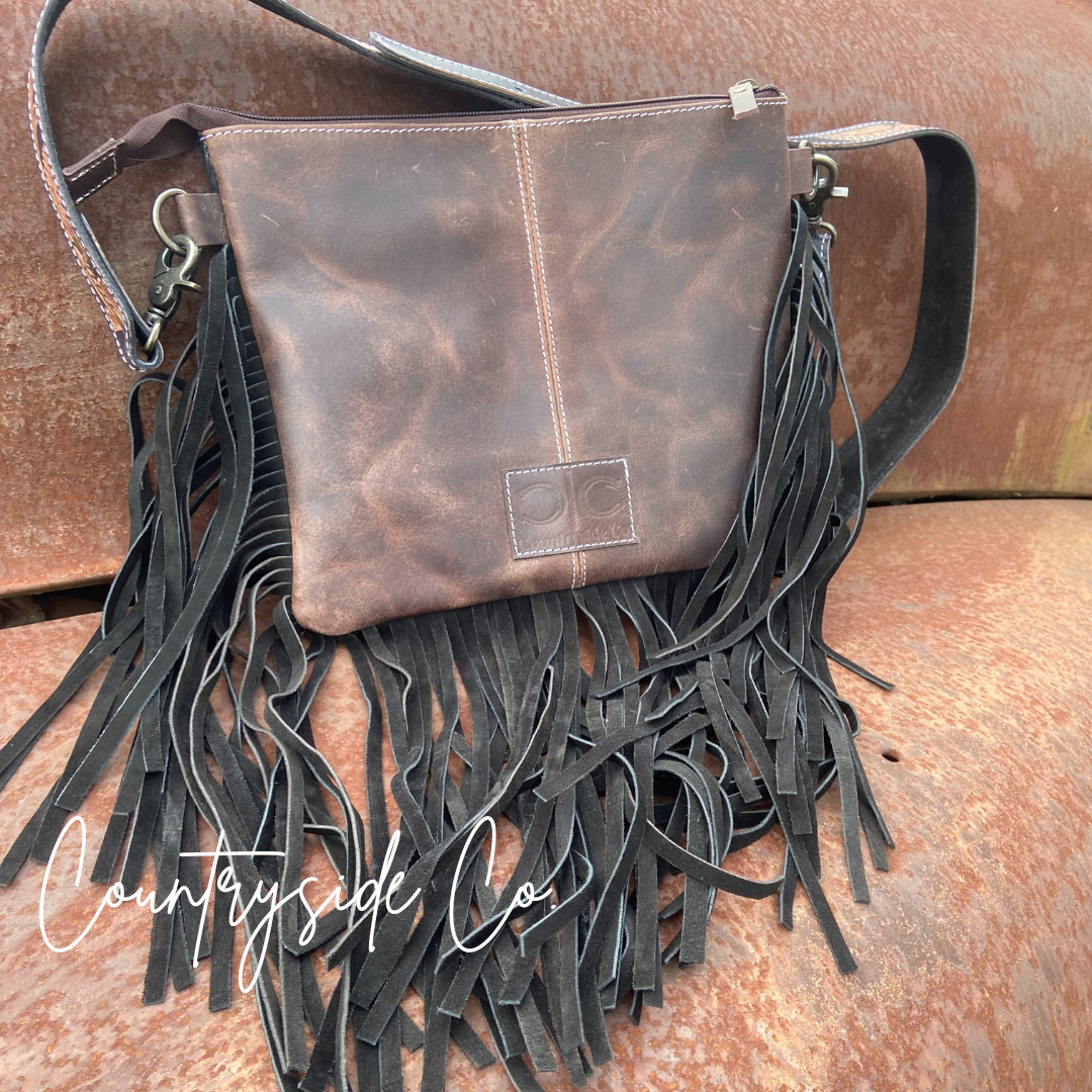 The Outlaw Cowhide Fringe Purse by Countryside Co.
