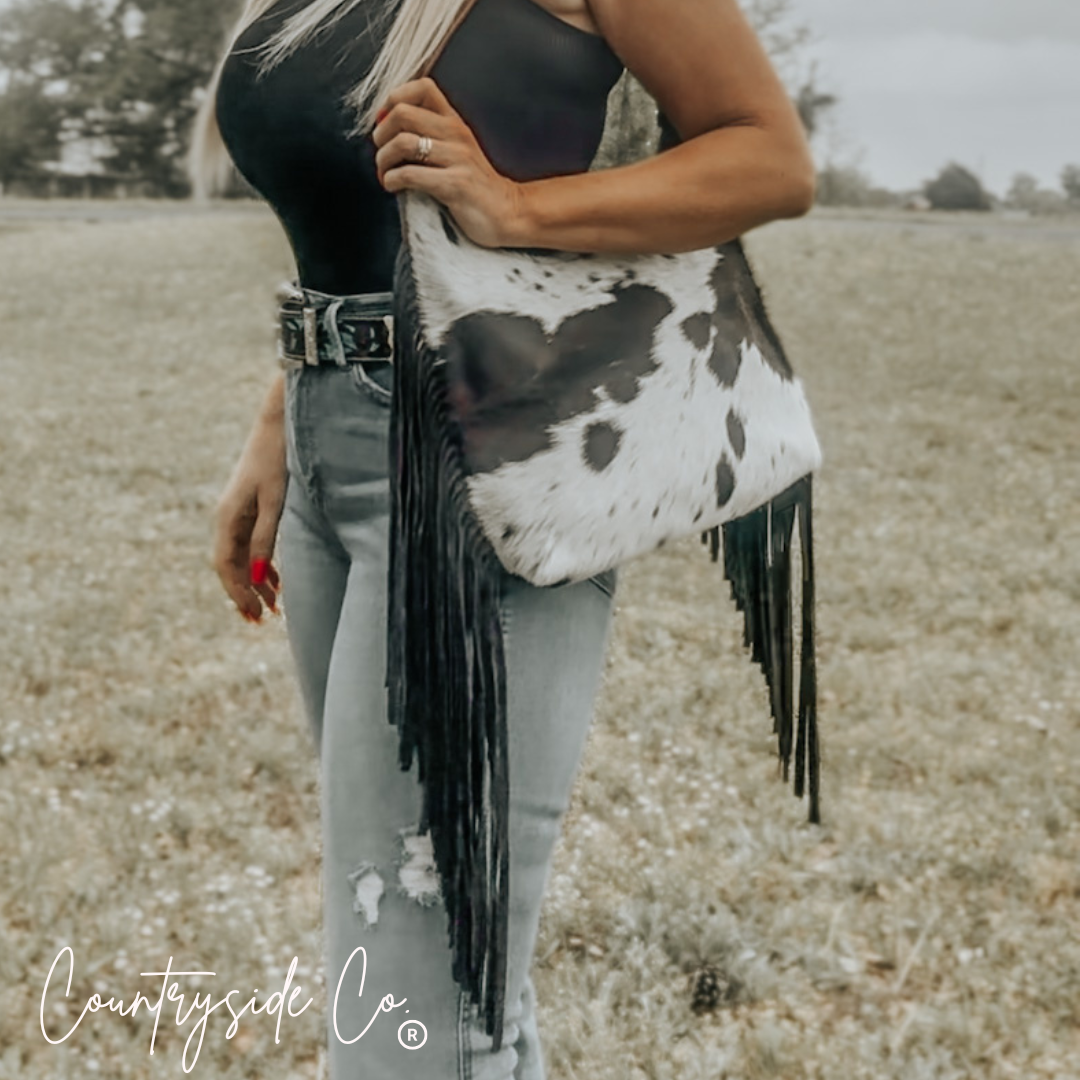 cowhide leather shoulder bag with fringe