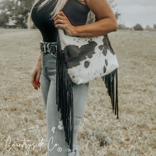 cowhide leather shoulder bag with fringe