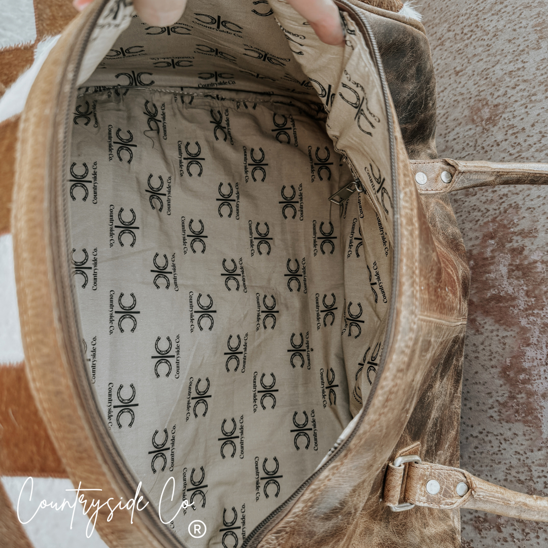 Reckless Checkered Cowhide Duffle Bag