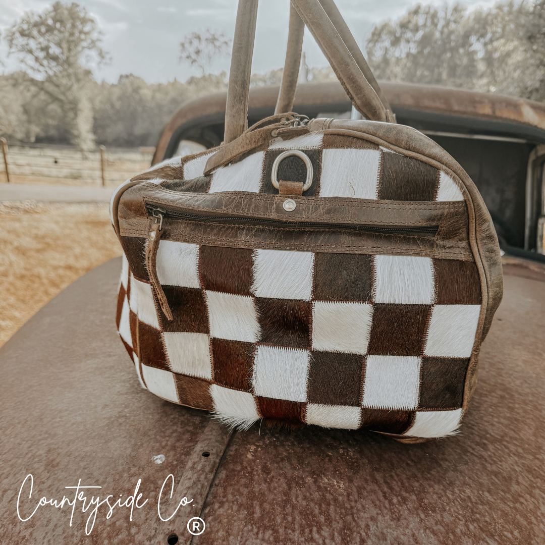 Reckless Checkered Cowhide Duffle Bag
