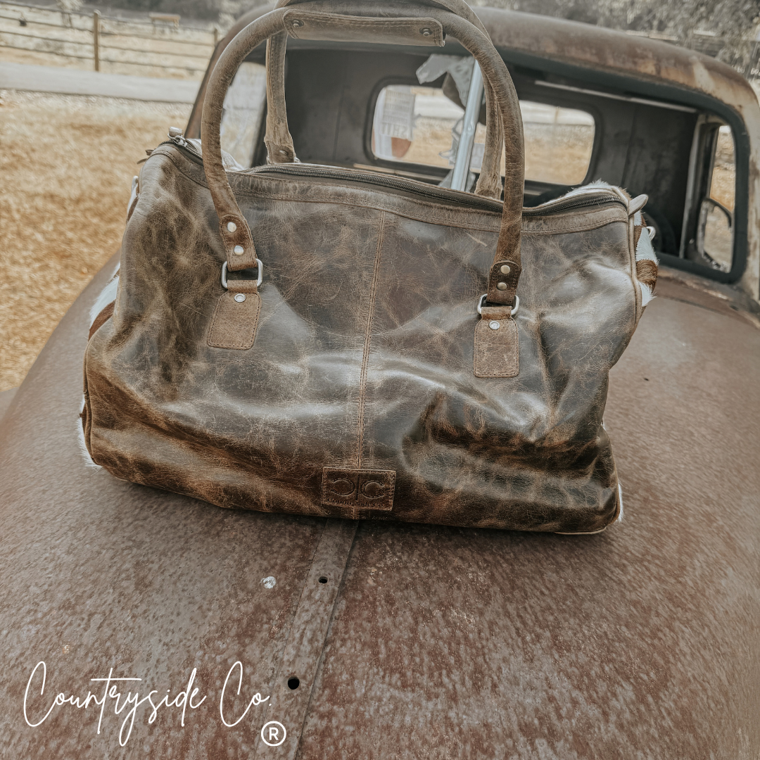 Reckless Checkered Cowhide Duffle Bag