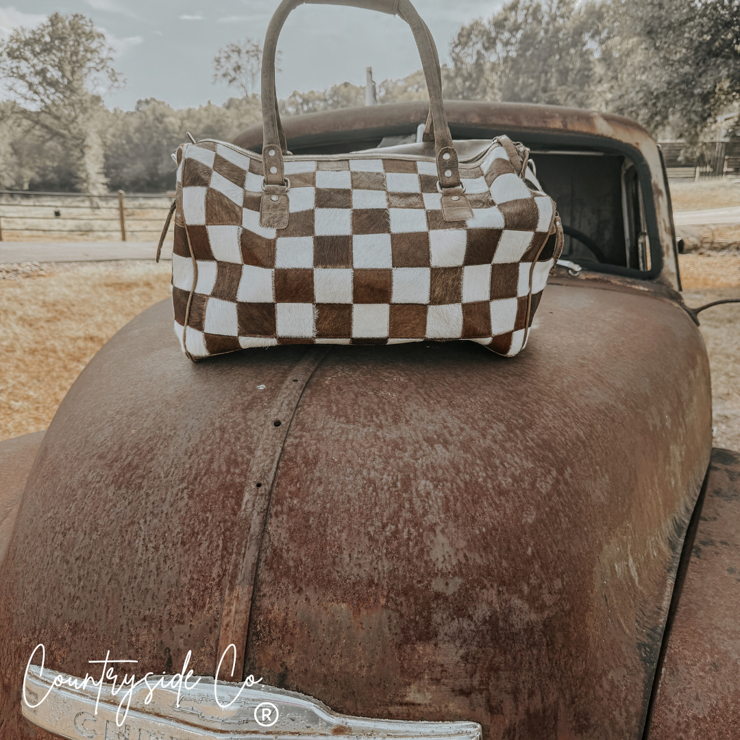 Reckless Checkered Cowhide Duffle Bag