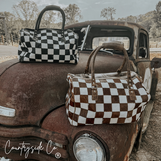 Reckless Checkered Cowhide Duffle Bag