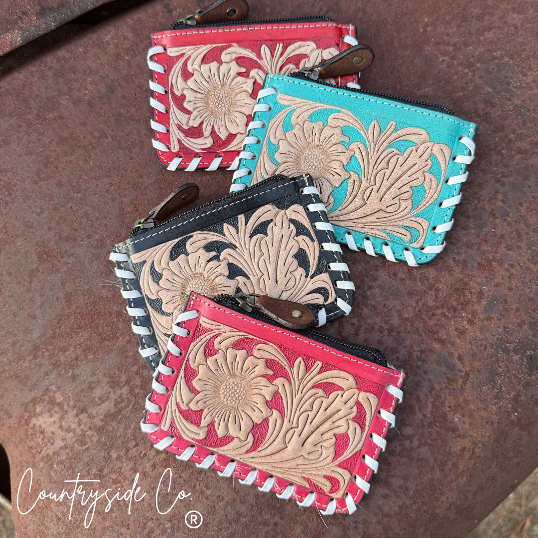 The Sweetwater Cowhide Laced Floral Pouch