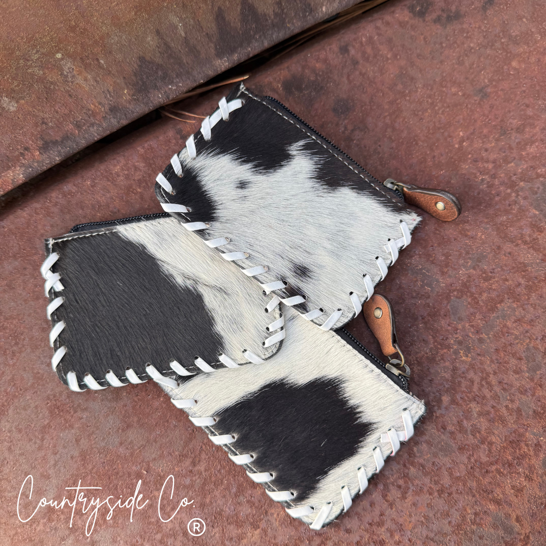 The Sweetwater Cowhide Laced Floral Pouch